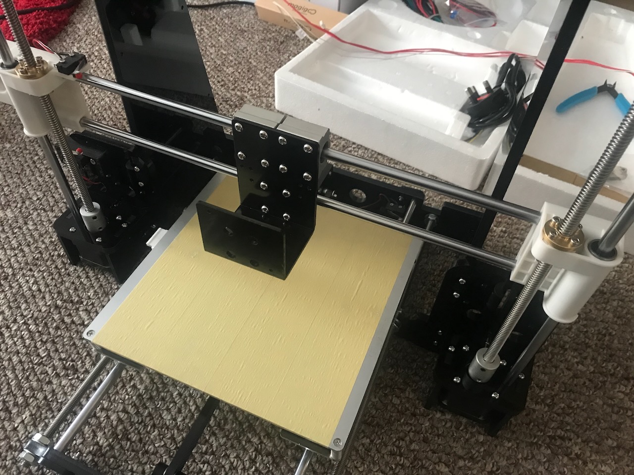 Screwing the X-Axis carriage to the bearings